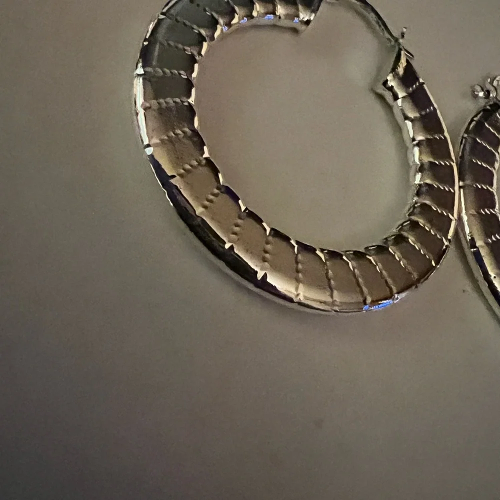 Shiny silver tone hoop earrings 2” length‎